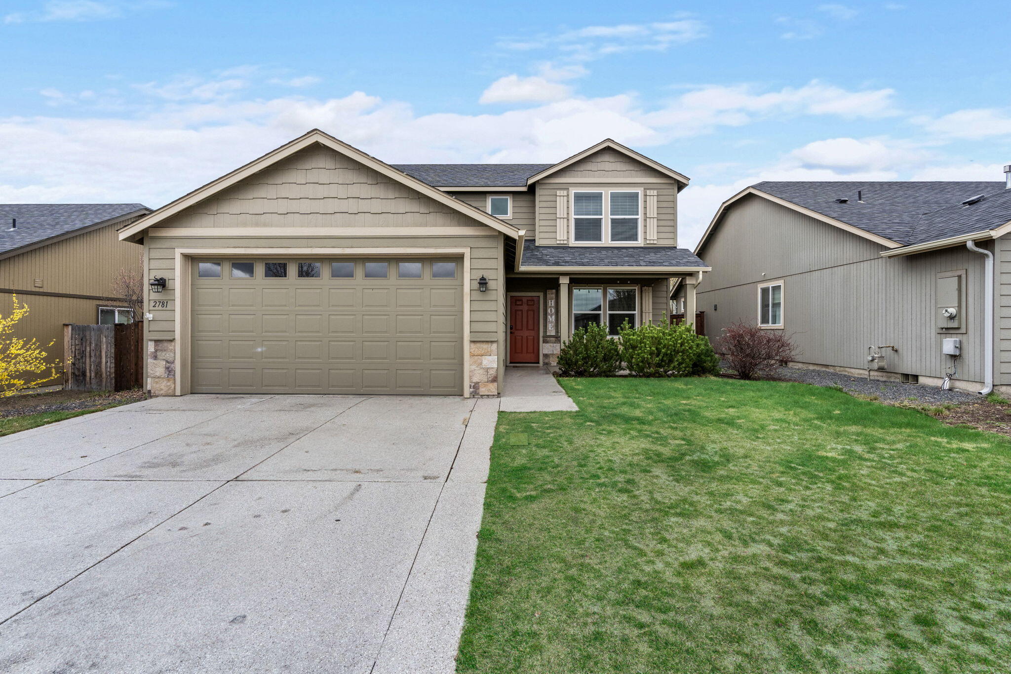 2781 Northeast Spring Water Place Bend, OR 97701 - Photo 19 of 23 a front view of a house with a garden and plants