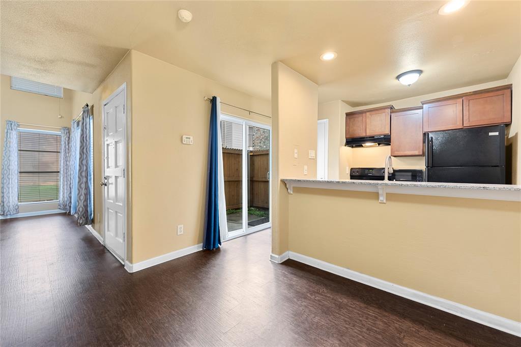 5516 Boca Raton Boulevard, Unit 310 Fort Worth, TX 76112 - Photo 5 of 19 a kitchen with stainless steel appliances granite countertop a refrigerator and a sink