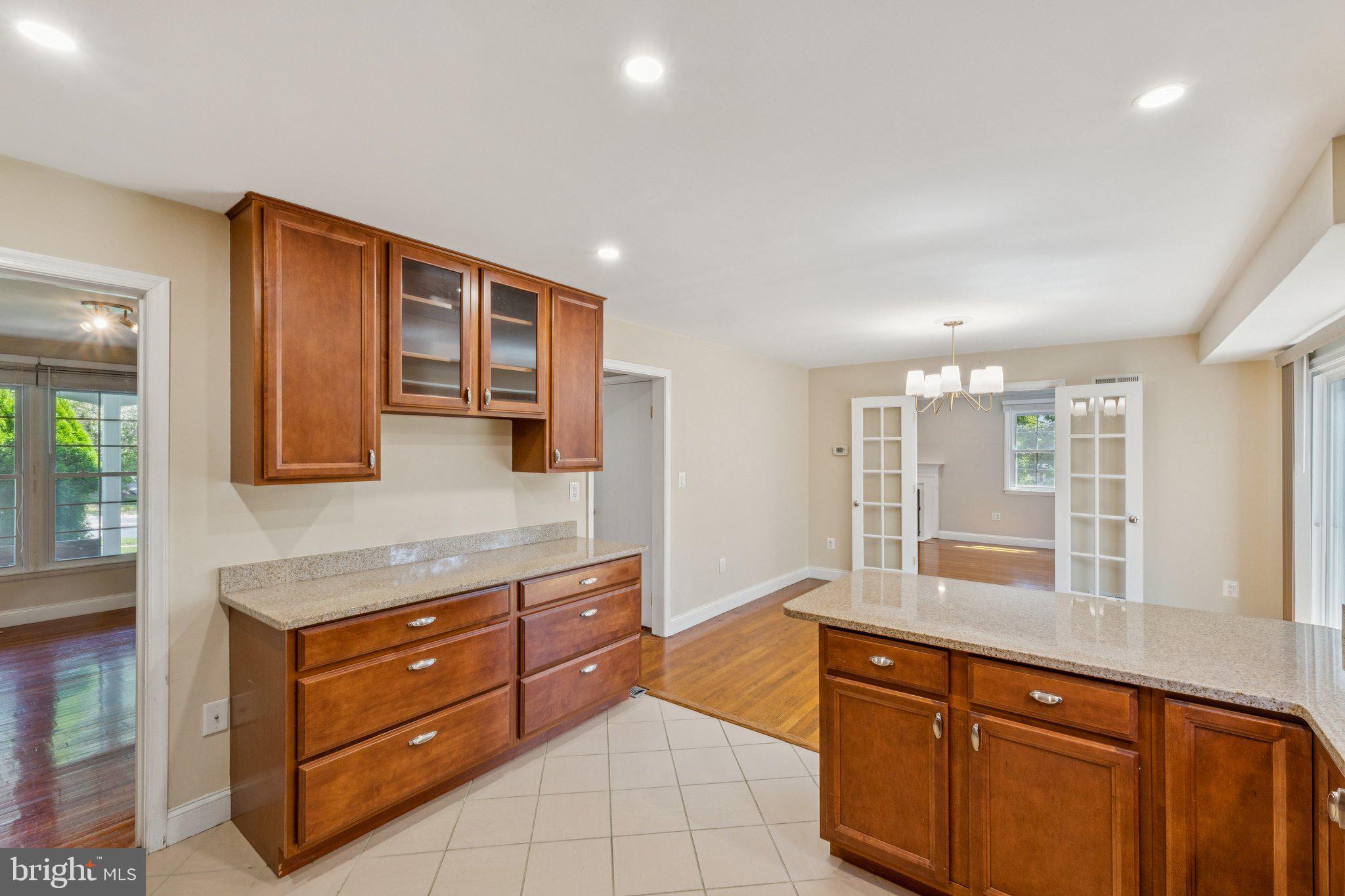 1900 Briggs Road Silver Spring, MD 20906 - Photo 14 of 44 a kitchen with stainless steel appliances granite countertop a stove and a sink