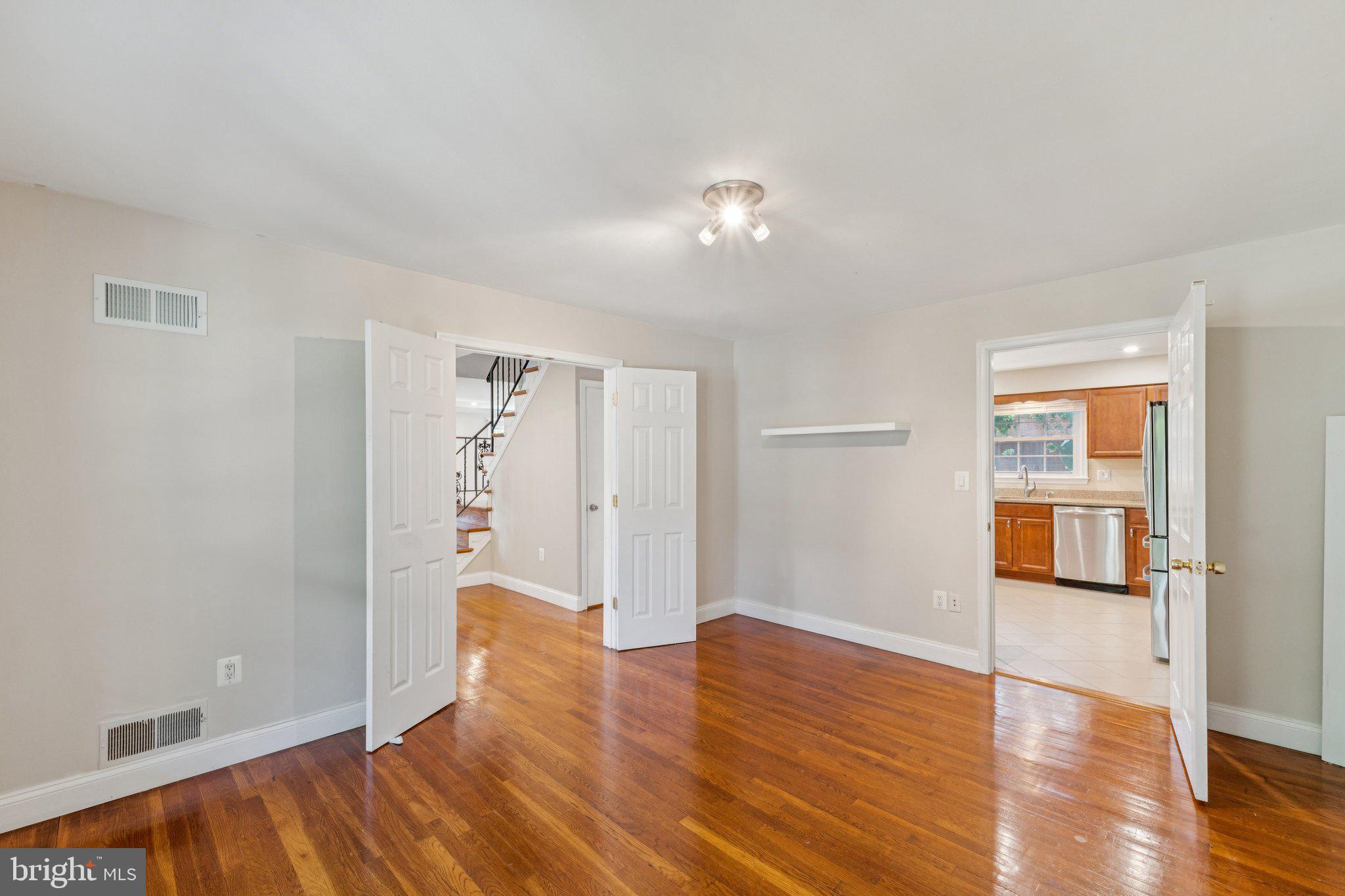 1900 Briggs Road Silver Spring, MD 20906 - Photo 16 of 44 a view of empty room with wooden floor