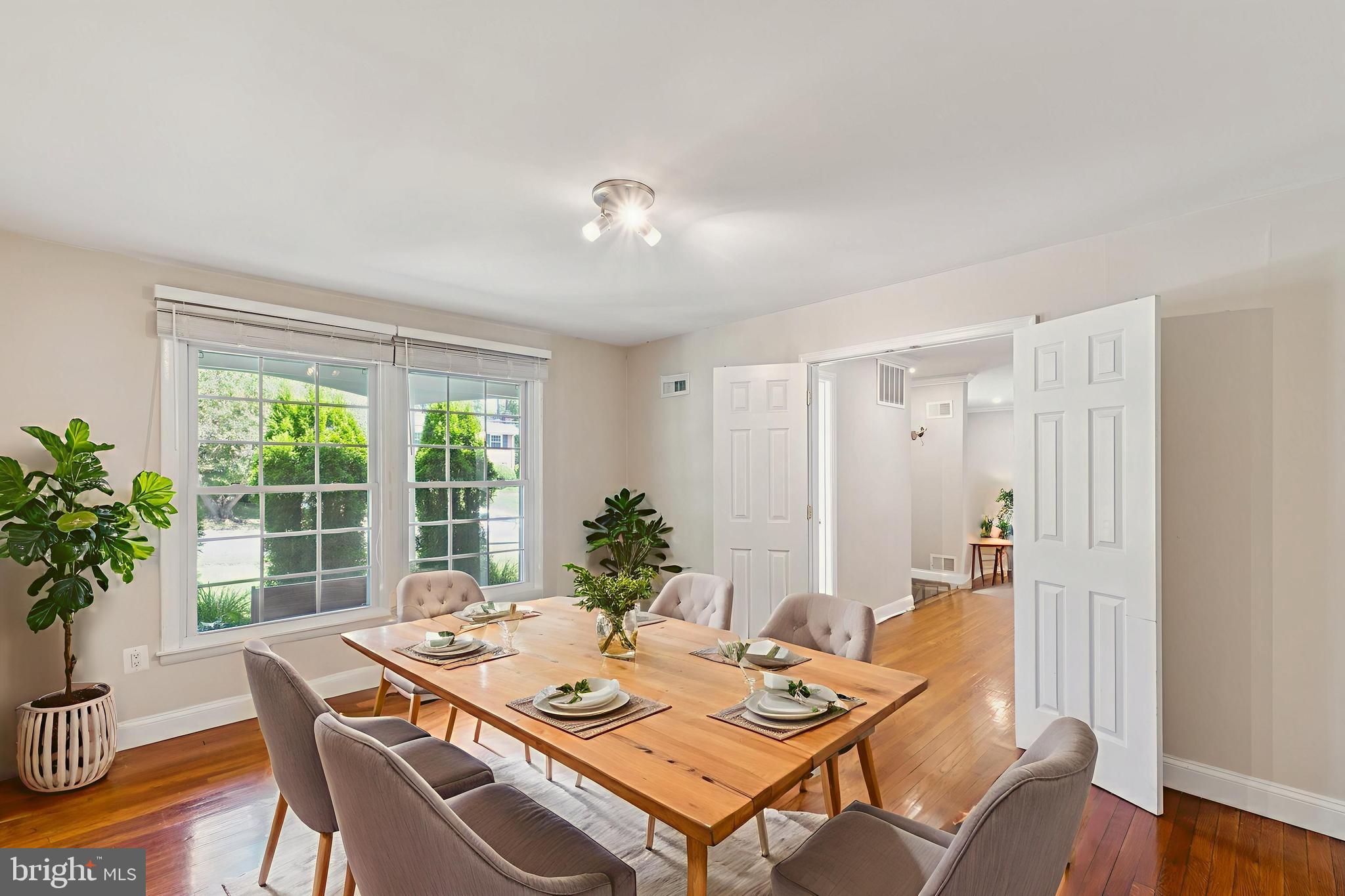 1900 Briggs Road Silver Spring, MD 20906 - Photo 17 of 44 a view of a dining room with furniture window and wooden floor