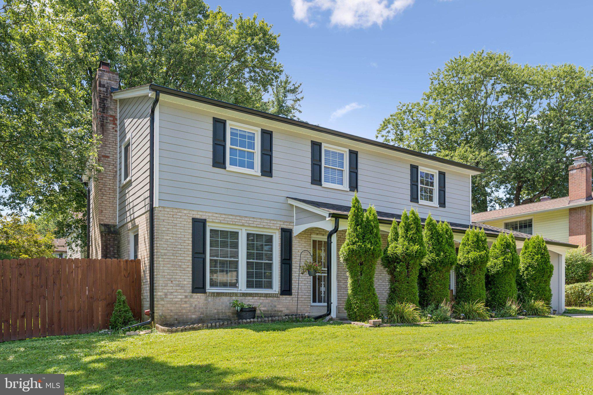 1900 Briggs Road Silver Spring, MD 20906 - Photo 3 of 44 front view of a house with a yard