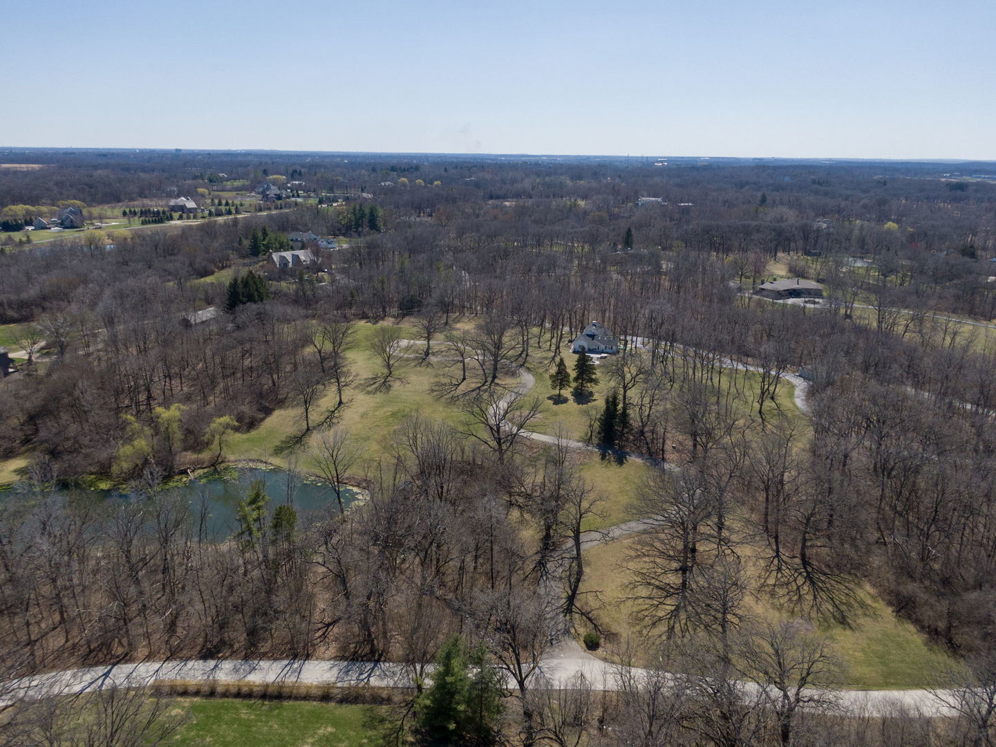 77 Brinker Road Barrington Hills, IL 60010 - Photo 3 of 13 a view of a lake in middle of the town