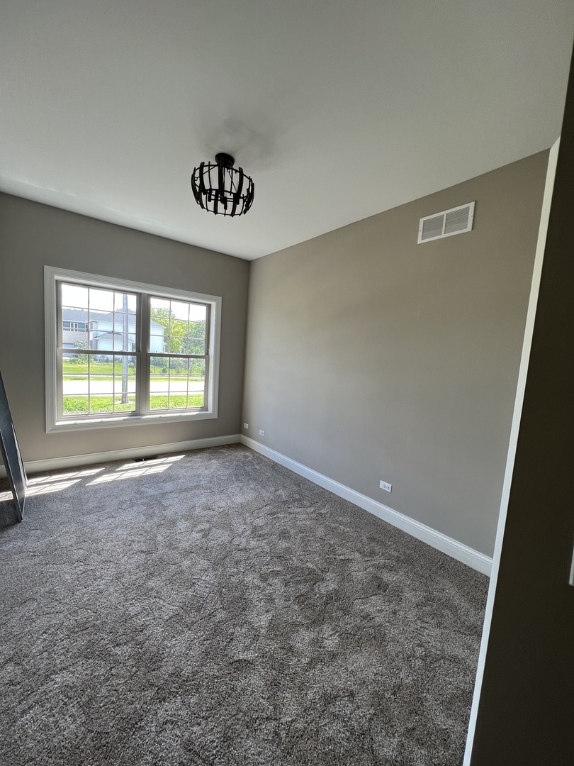 26501 Stephanie Drive Channahon, IL 60410 - Photo 4 of 14 an empty room with windows