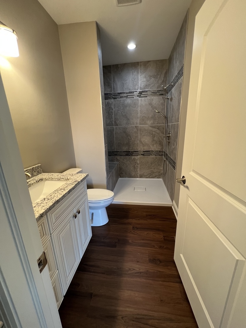 26501 Stephanie Drive Channahon, IL 60410 - Photo 5 of 14 a bathroom with a sink and a mirror