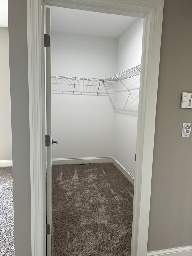 26501 Stephanie Drive Channahon, IL 60410 - Photo 7 of 14 a view of a room with racks on the wall