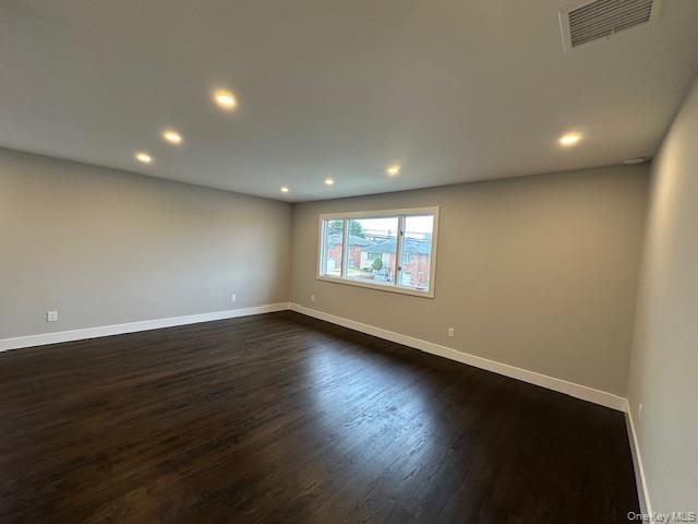5 Linwood Road North, Unit 2 Port Washington, NY 11050 - Photo 6 of 12 Living room featuring dark wood-style floors and recessed lighting