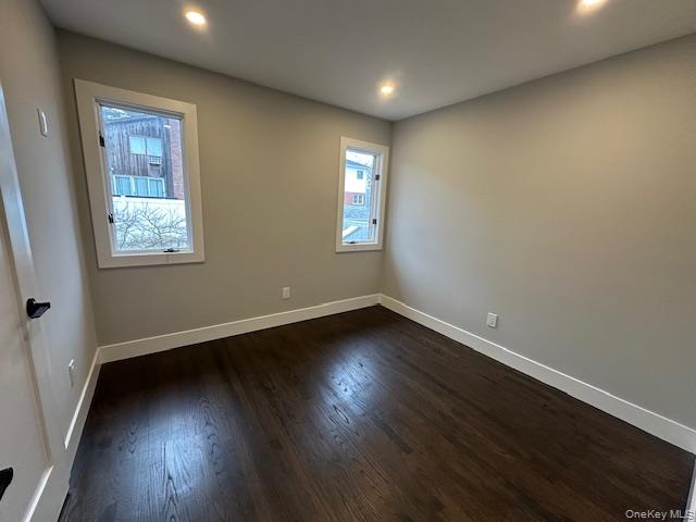 5 Linwood Road North, Unit 2 Port Washington, NY 11050 - Photo 9 of 12 Bedroom featuring dark wood-style flooring and recessed lighting