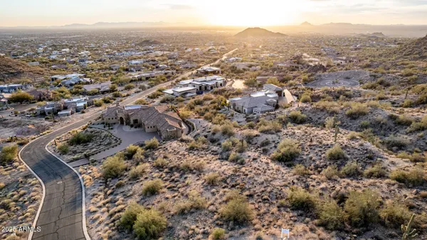 an aerial view of house with yard