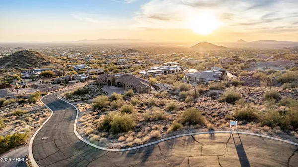 a view of a city with lush green forest