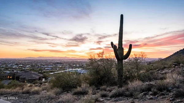 a view of a city with mountains in the background