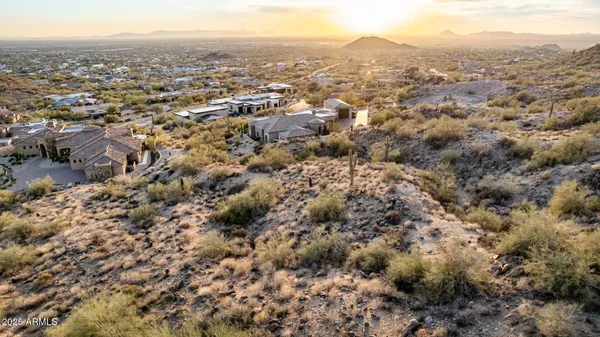 a view of a city with lush green forest