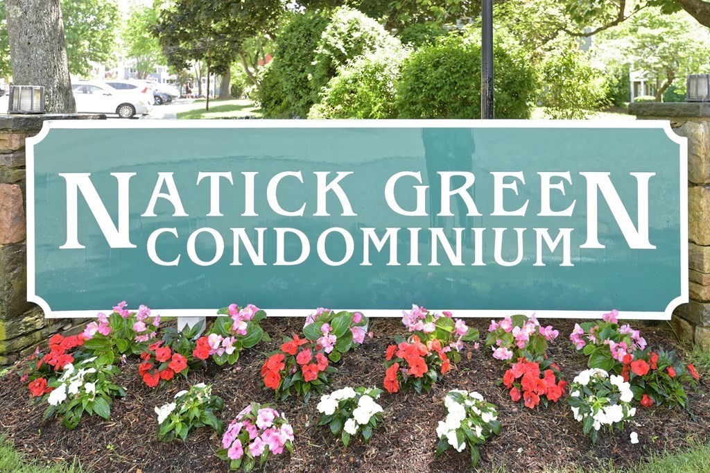 a street sign that is on a wooden wall