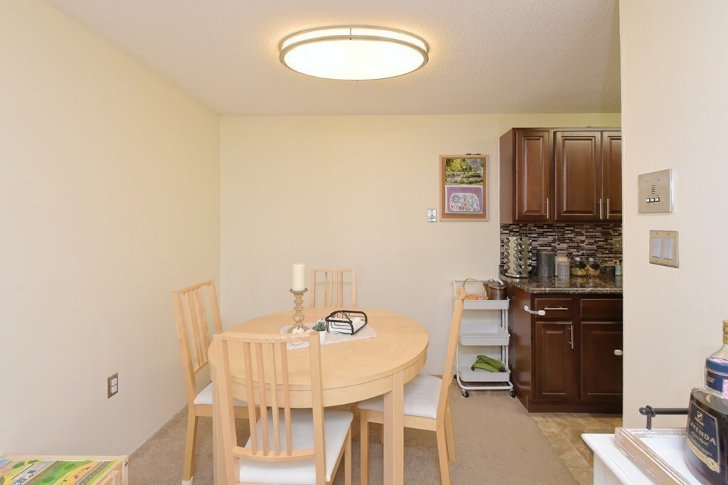 32 Silver Hill Lane, Unit 1 Natick, MA 01760 - Photo 14 of 36 a view of a dining room with furniture