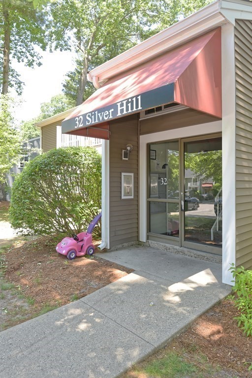 32 Silver Hill Lane, Unit 1 Natick, MA 01760 - Photo 2 of 36 a front view of a house with a yard