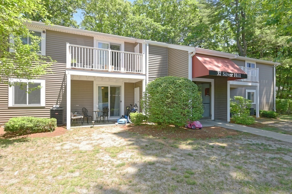 32 Silver Hill Lane, Unit 1 Natick, MA 01760 - Photo 3 of 36 front view of a house with a yard