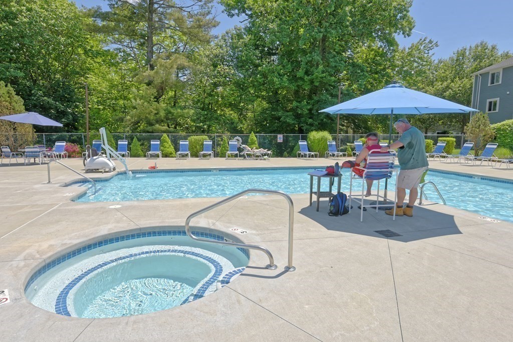 32 Silver Hill Lane, Unit 1 Natick, MA 01760 - Photo 32 of 36 a swimming pool with outdoor seating yard and barbeque oven