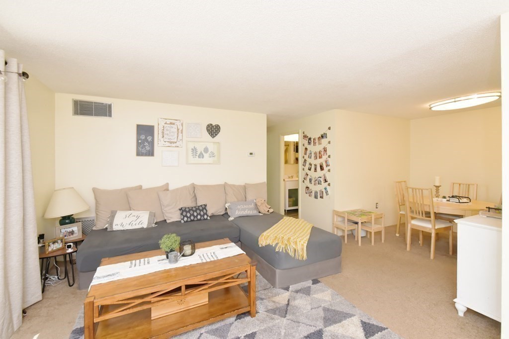 32 Silver Hill Lane, Unit 1 Natick, MA 01760 - Photo 6 of 36 a living room with furniture and wooden floor