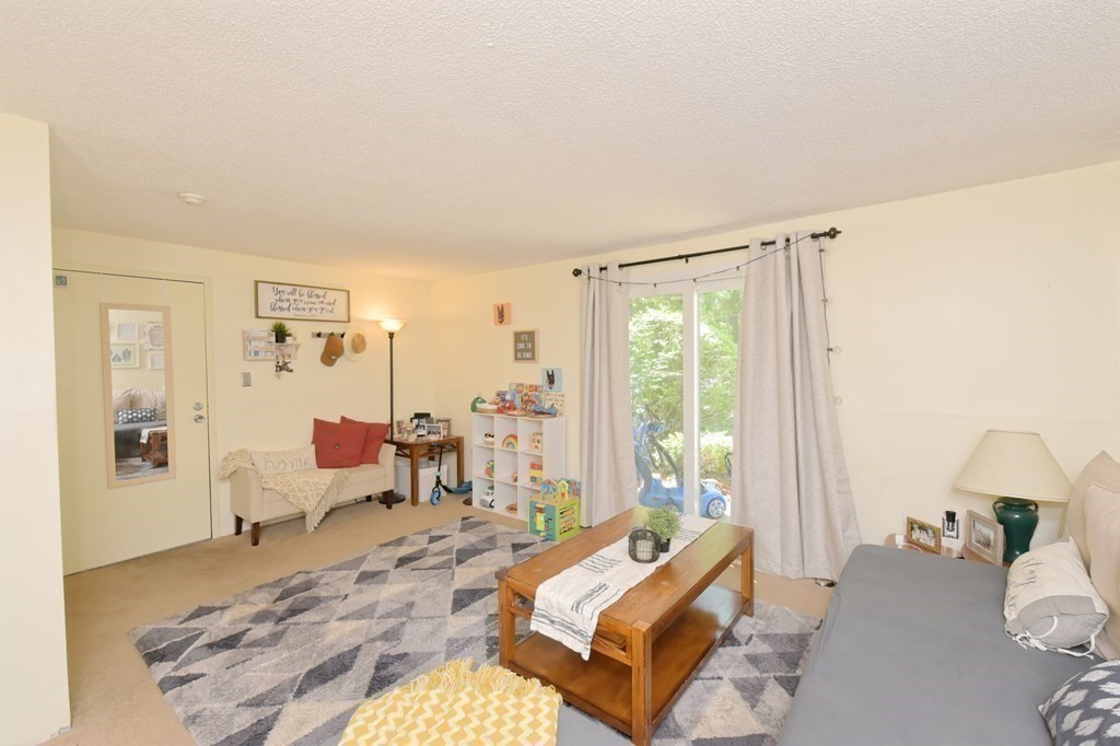 32 Silver Hill Lane, Unit 1 Natick, MA 01760 - Photo 7 of 36 a bedroom with furniture and a window