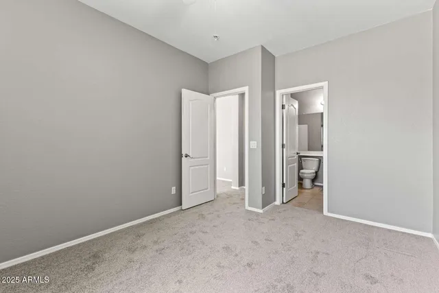 a view of an empty room with glass door