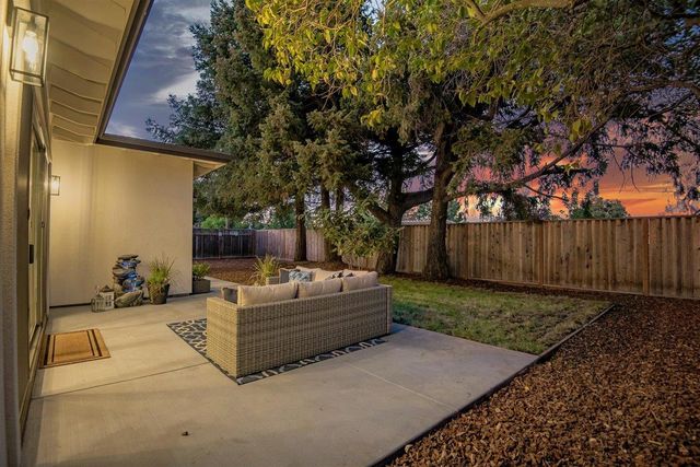 a backyard of a house with seating space