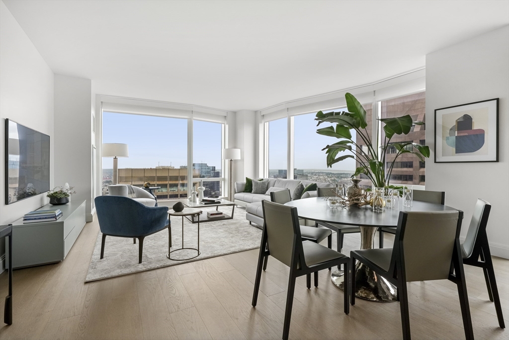 240 Devonshire Street, Unit 5612 Boston, MA 02110 - Photo 3 of 42 a view of a dining room with furniture and a potted plant