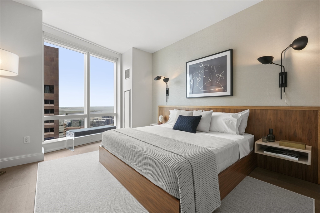 240 Devonshire Street, Unit 5612 Boston, MA 02110 - Photo 5 of 42 a bedroom with a large bed and a large window