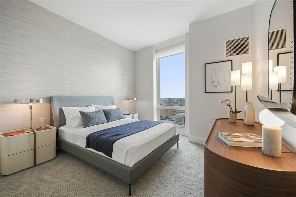 240 Devonshire Street, Unit 5612 Boston, MA 02110 - Photo 7 of 42 a bedroom with a bed and lamp