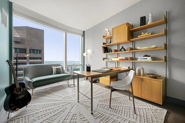 a workspace with furniture and window