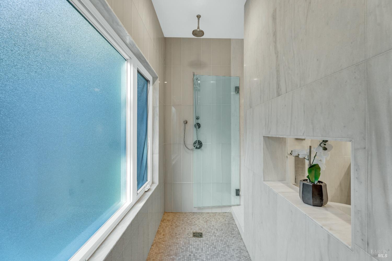 30 Bella Vista Avenue Belvedere, CA 94920 - Photo 31 of 89 a bathroom with a tub and shower