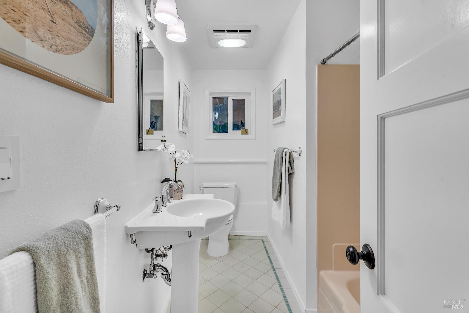 30 Bella Vista Avenue Belvedere, CA 94920 - Photo 41 of 89 a bathroom with a sink and a mirror