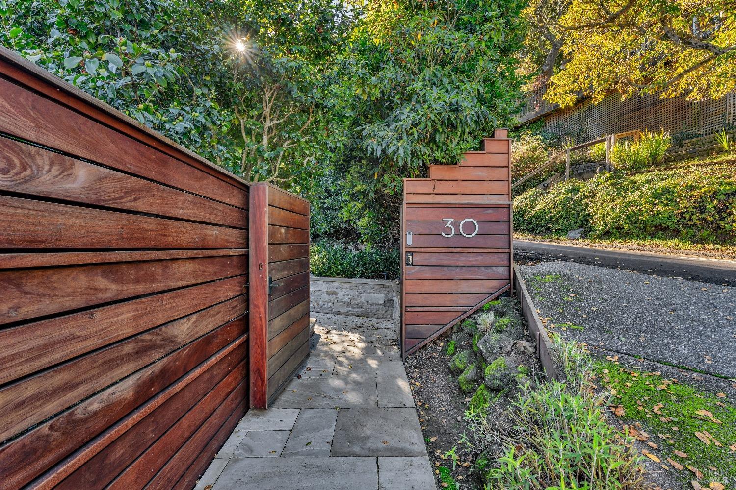 30 Bella Vista Avenue Belvedere, CA 94920 - Photo 81 of 89 a view of a pathway with a wooden bench