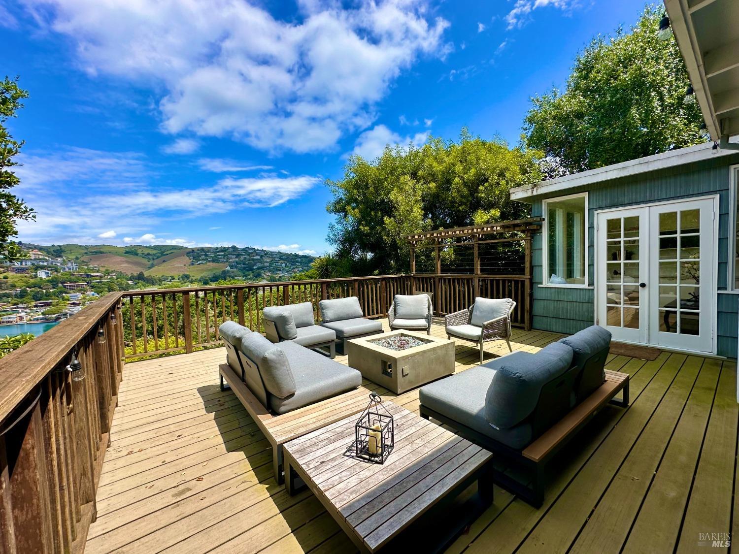 30 Bella Vista Avenue Belvedere, CA 94920 - Photo 9 of 89 a balcony with wooden floor and outdoor seating