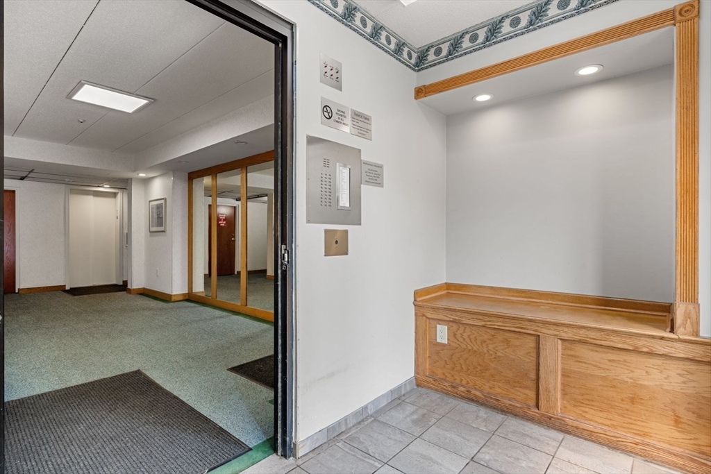 135 Franklin Street, Unit 101 Stoneham, MA 02180 - Photo 21 of 24 a view of a hallway with closet
