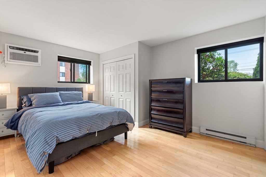 135 Franklin Street, Unit 101 Stoneham, MA 02180 - Photo 10 of 24 a bedroom with a bed and a window