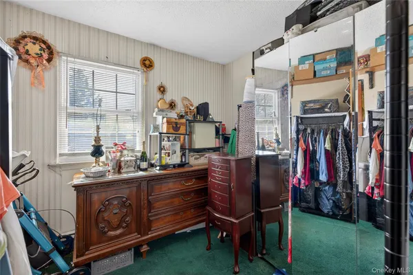 a room with furniture a flat screen tv and a fireplace