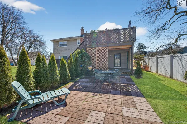 a view of a chair and table in the patio