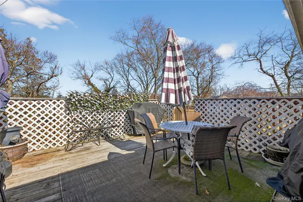 a outdoor space with a table and chairs
