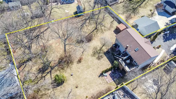 an aerial view of a house with a yard