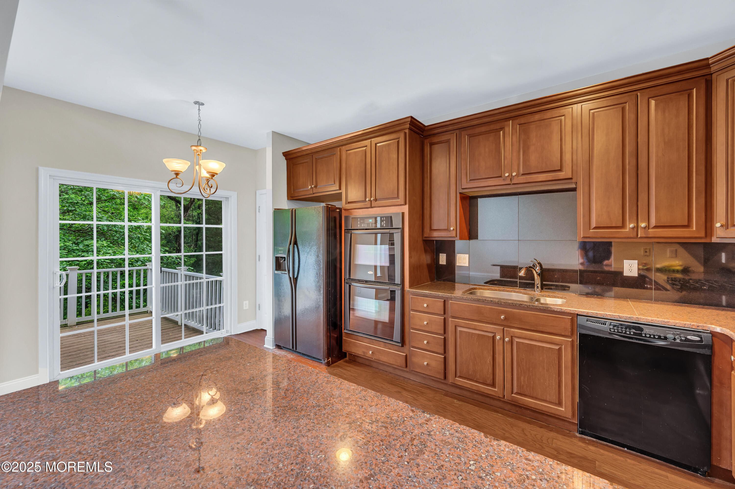 59 Brookfield Drive Jackson, NJ 08527 - Photo 11 of 42 a kitchen that has a sink a stove and cabinets