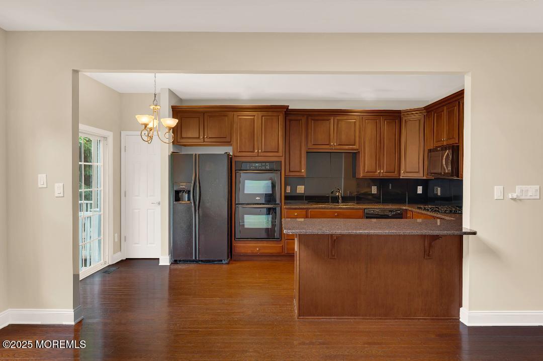 59 Brookfield Drive Jackson, NJ 08527 - Photo 14 of 42 a kitchen with stainless steel appliances granite countertop a refrigerator and a stove top oven
