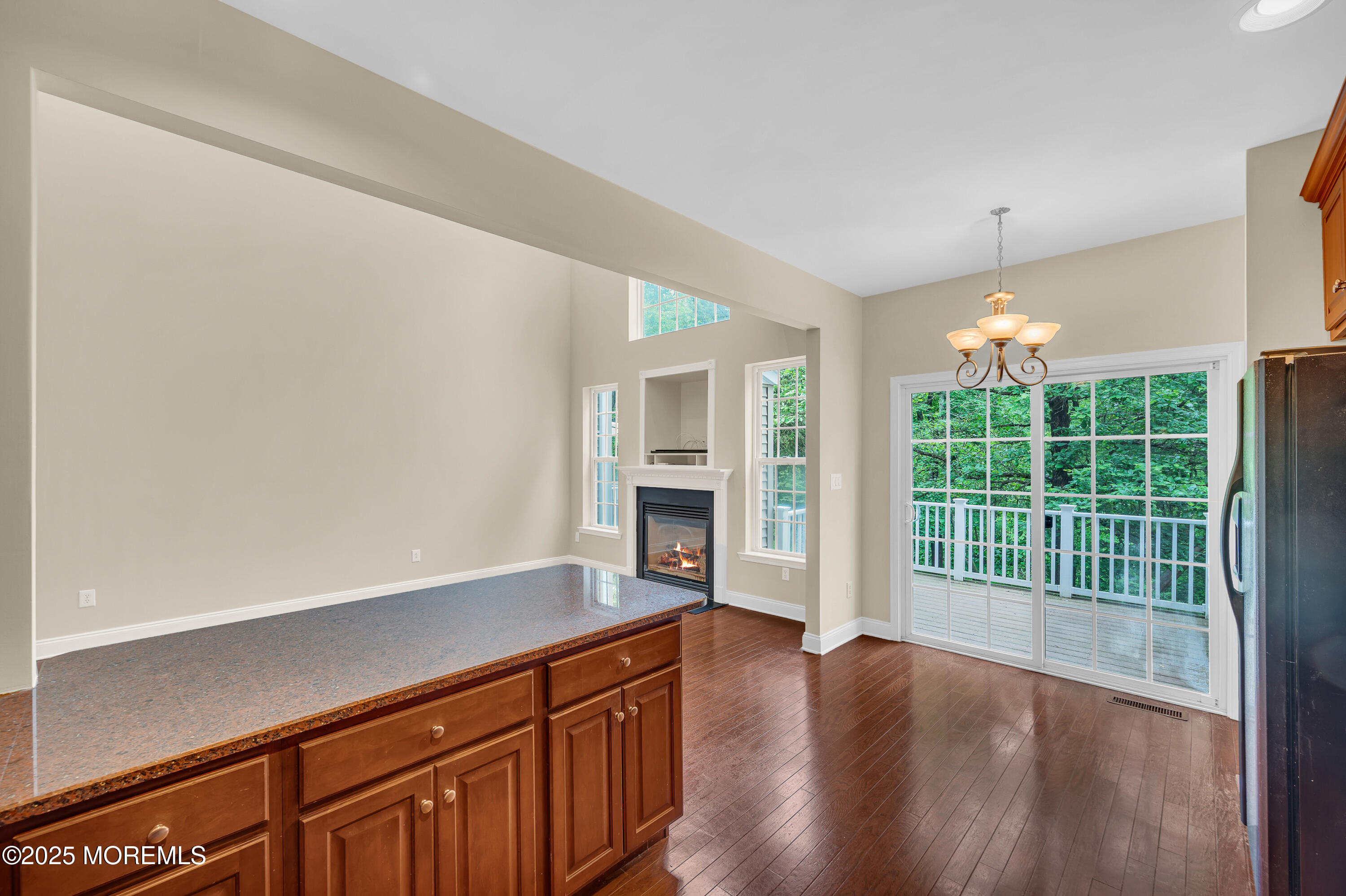 59 Brookfield Drive Jackson, NJ 08527 - Photo 15 of 42 wooden floor in an empty room with a window
