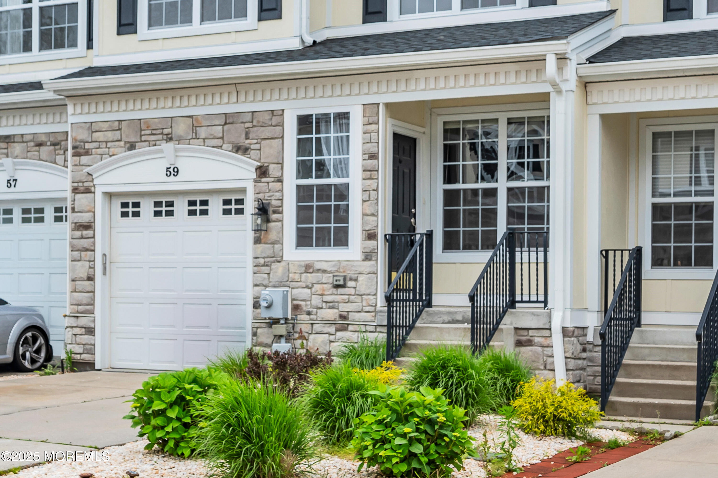 59 Brookfield Drive Jackson, NJ 08527 - Photo 2 of 42 front view of a building with potted plants