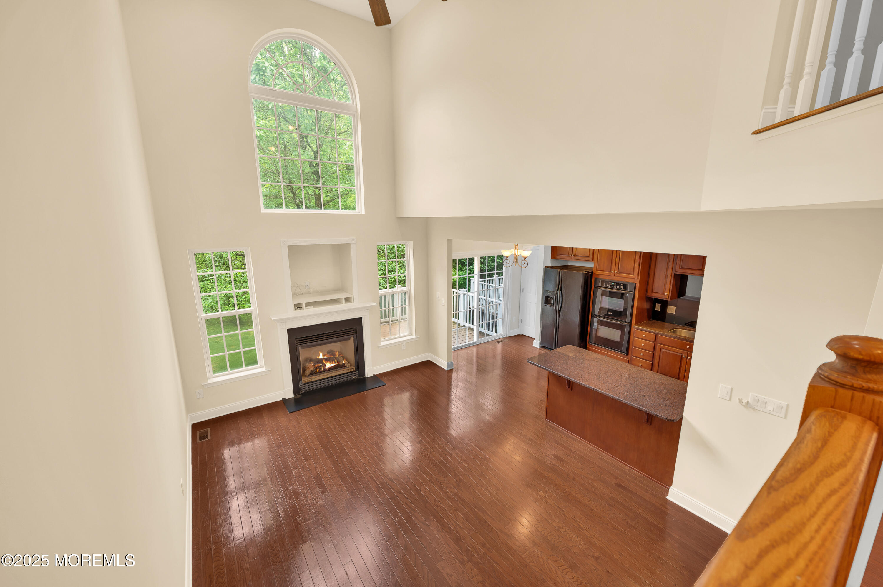 59 Brookfield Drive Jackson, NJ 08527 - Photo 21 of 42 a view of a livingroom with a fireplace wooden floor and a window