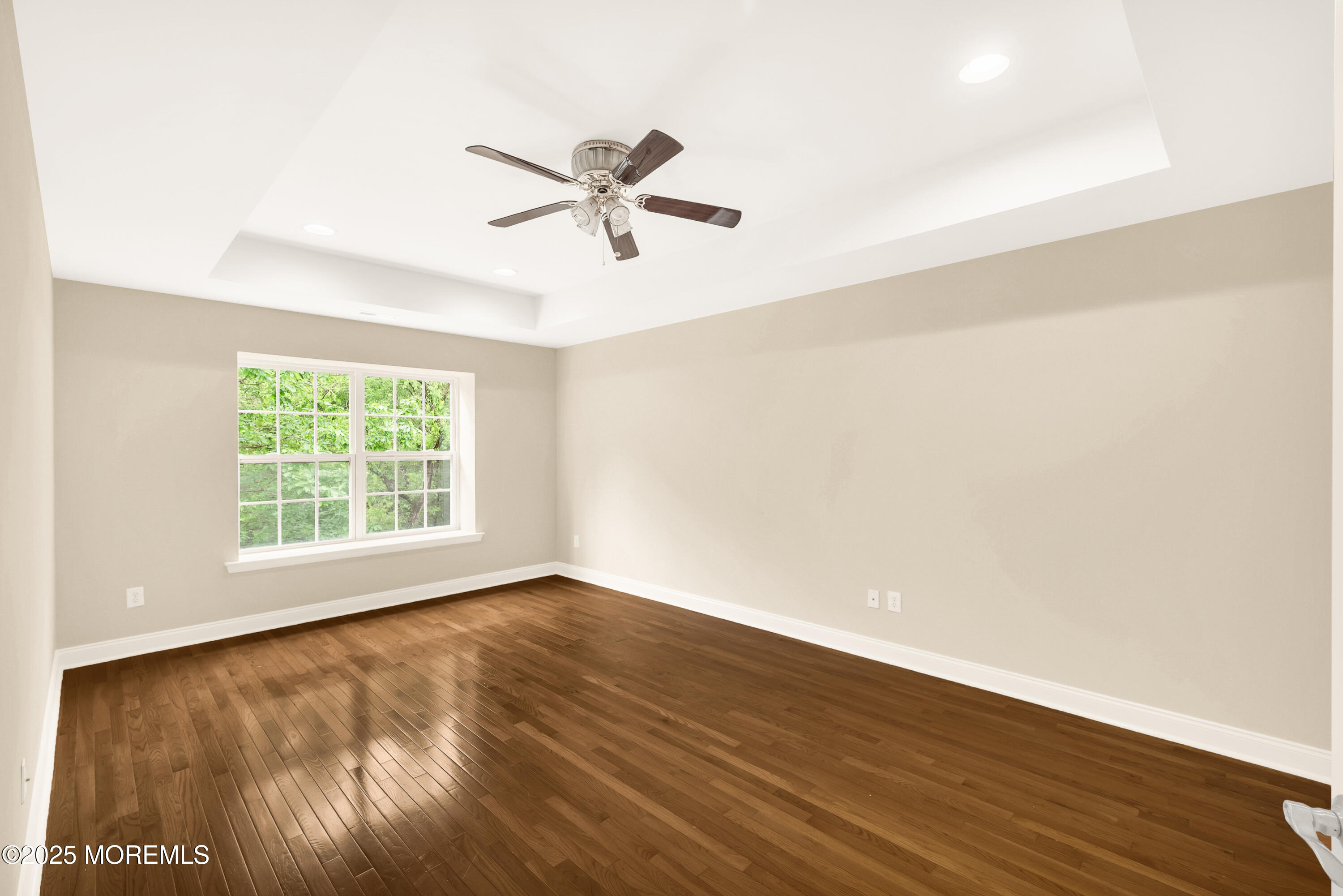 59 Brookfield Drive Jackson, NJ 08527 - Photo 26 of 42 a view of an empty room with wooden floor and a window