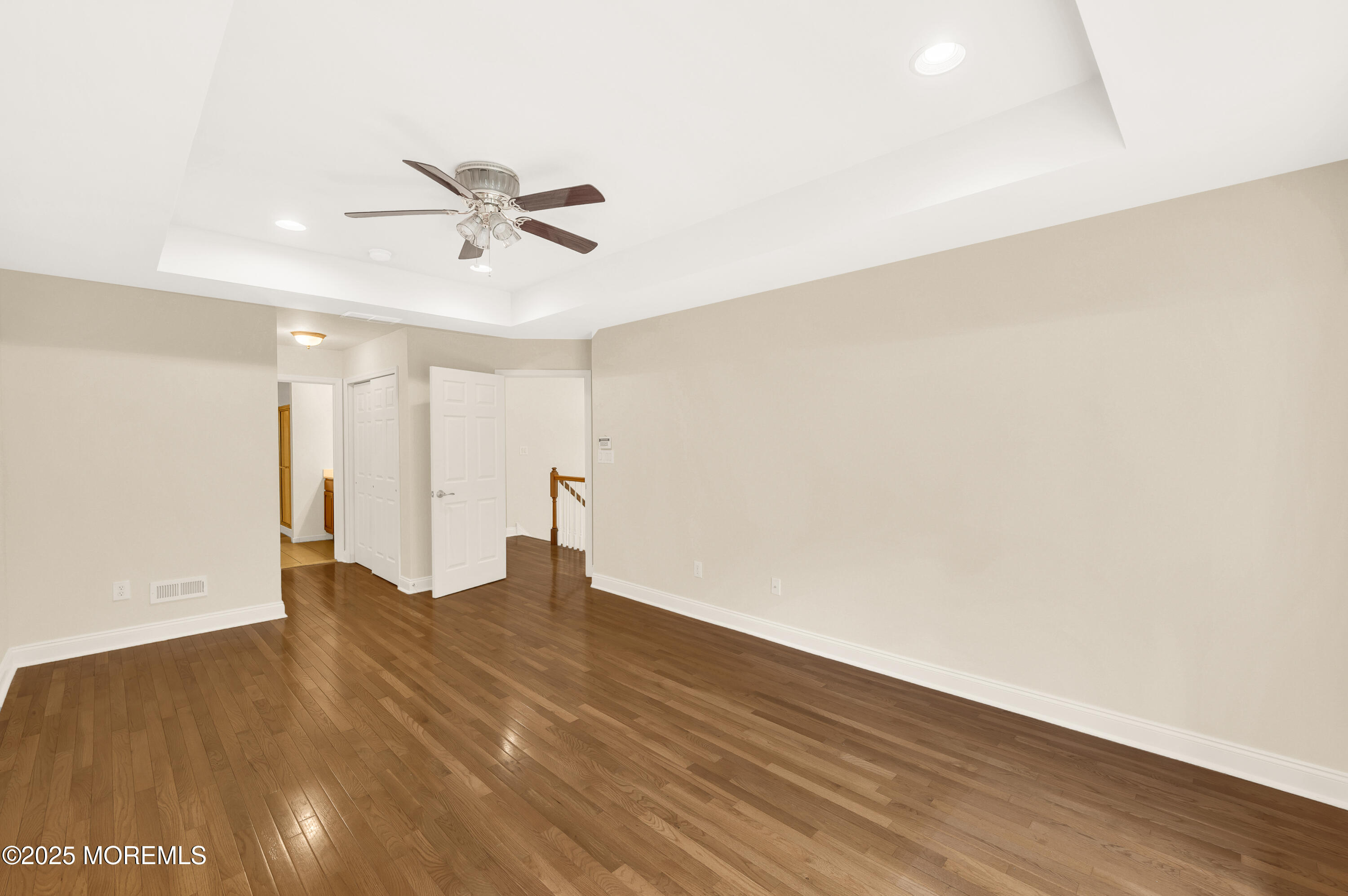 59 Brookfield Drive Jackson, NJ 08527 - Photo 27 of 42 a view of an empty room with wooden floor