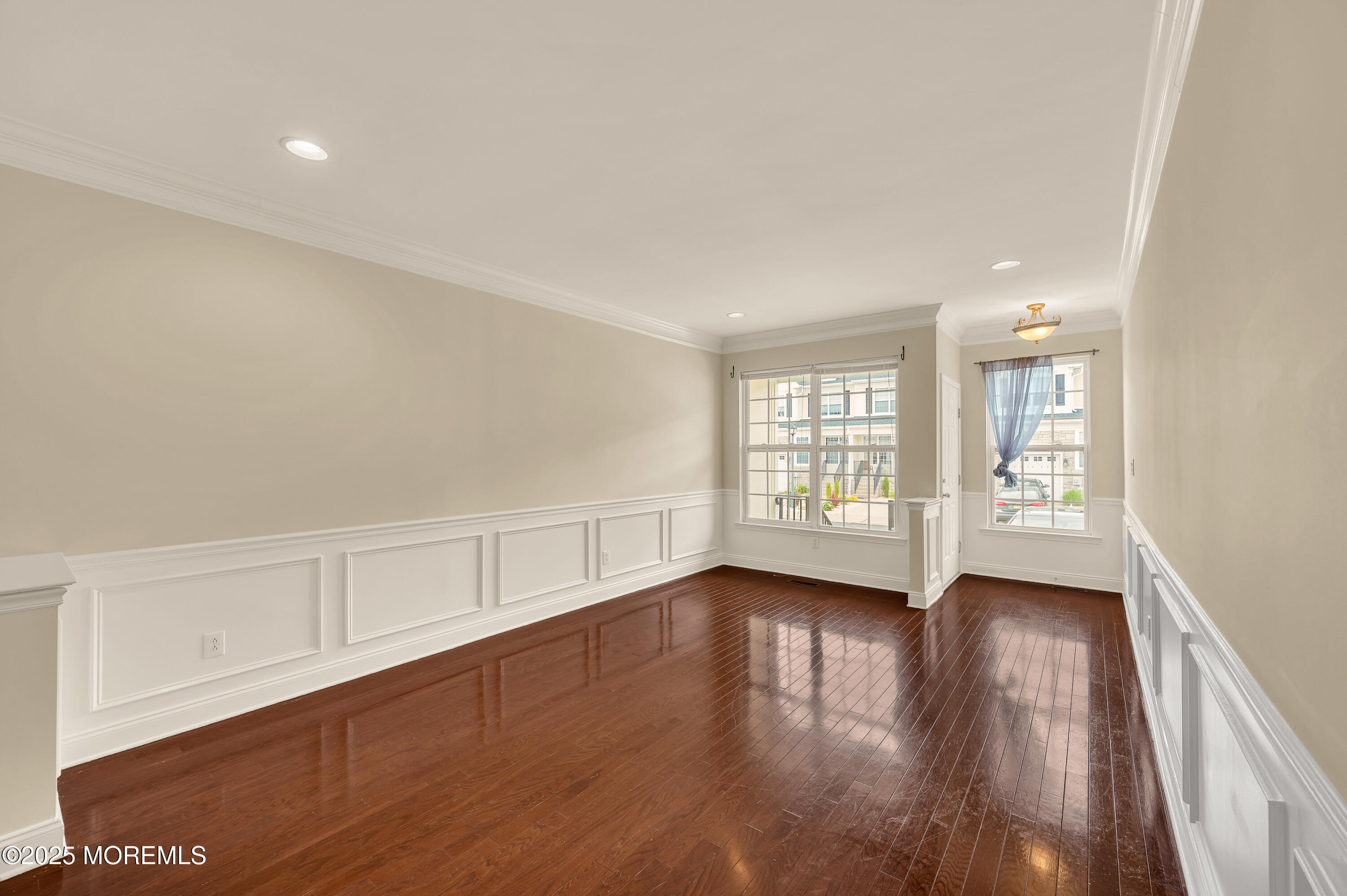 59 Brookfield Drive Jackson, NJ 08527 - Photo 3 of 42 a view of an empty room with wooden floor and a window