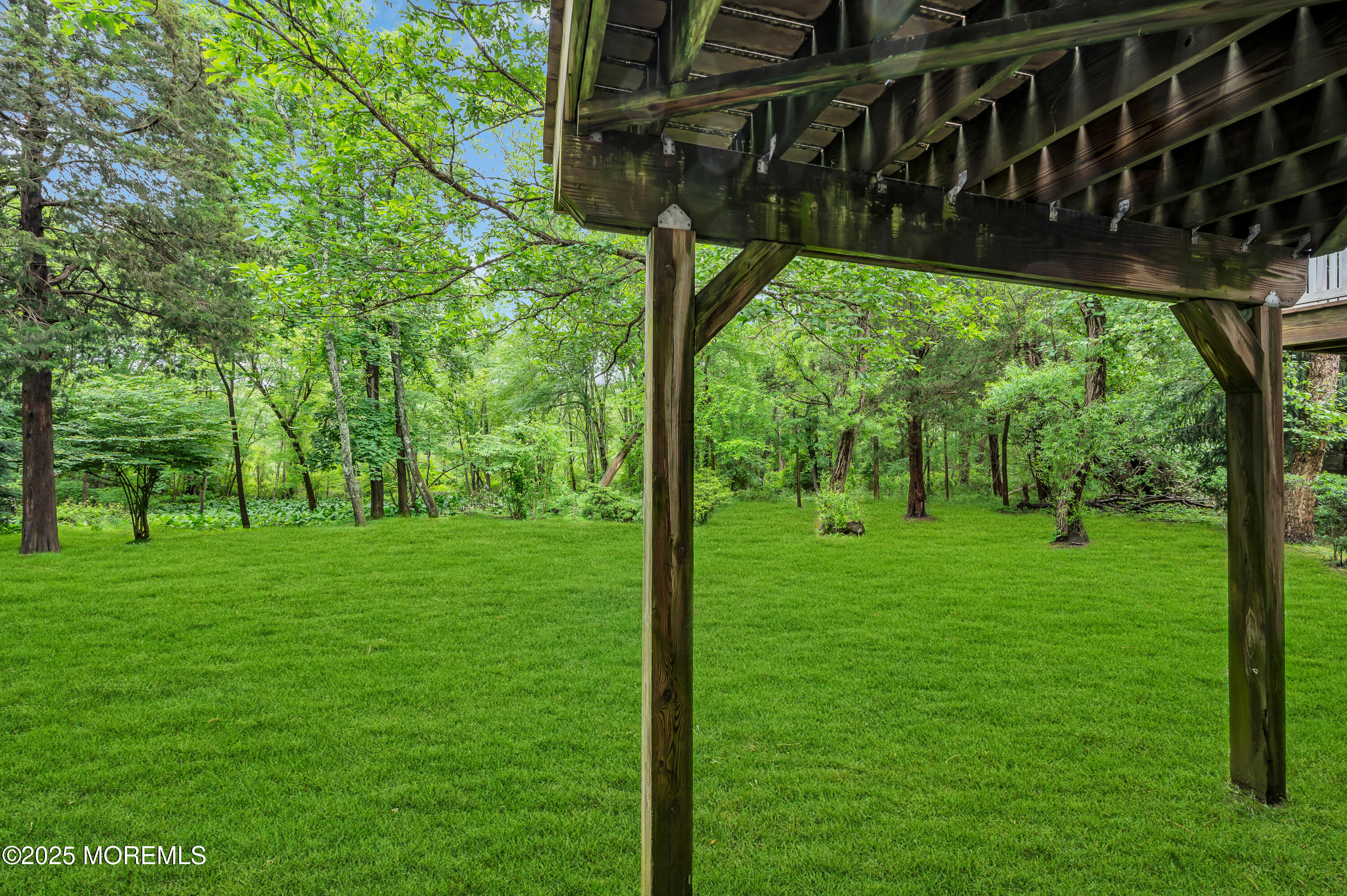 59 Brookfield Drive Jackson, NJ 08527 - Photo 33 of 42 a view of a backyard with a garden