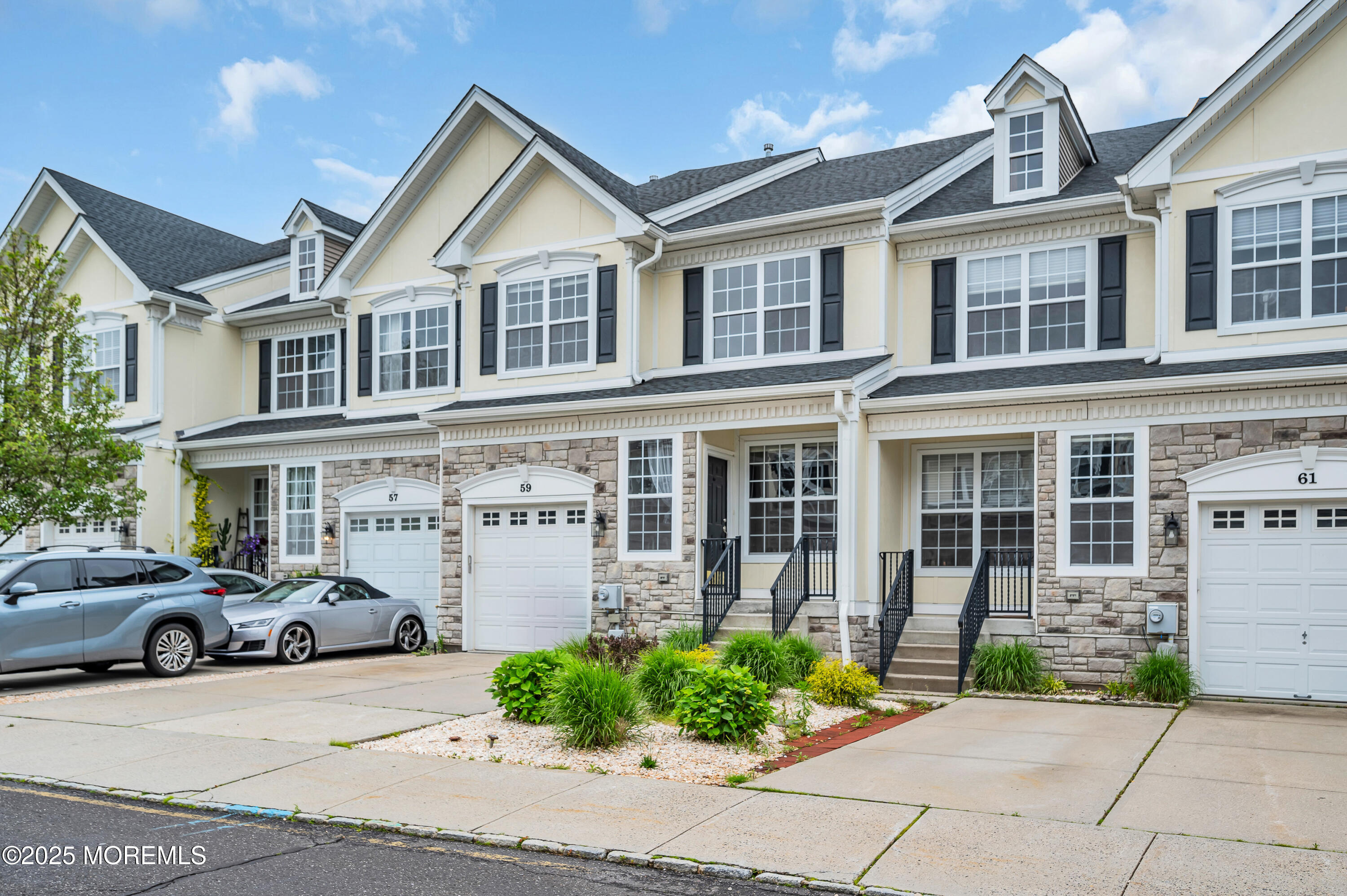 59 Brookfield Drive Jackson, NJ 08527 - Photo 34 of 42 a couple of cars parked in front of a building