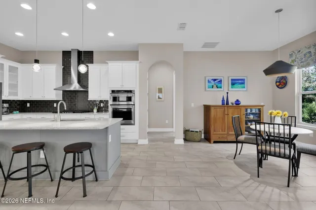 a kitchen with a refrigerator and sink